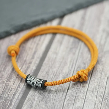 Bracelet en Corde Tressée avec Symbole Mystique - Perles Fait Main Ajustable pour Homme