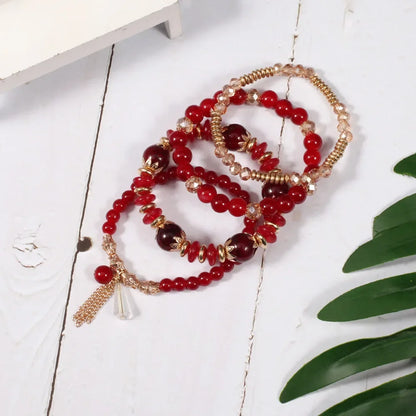 Set de 4 Bracelets Bohèmes Perles Verre Colorées - Pompons et Charms