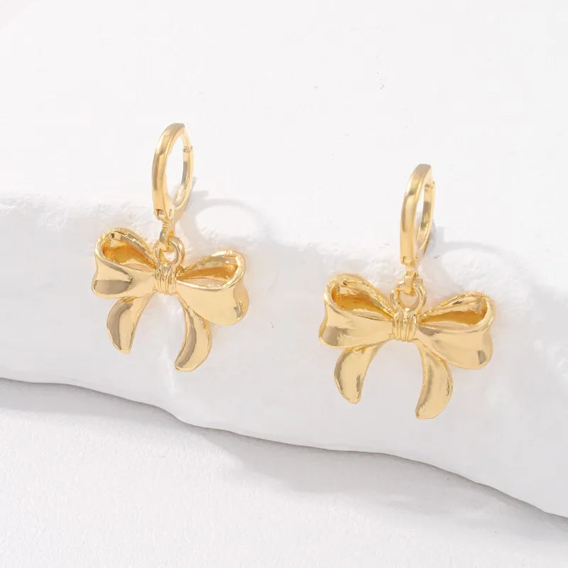 Boucles d'Oreilles Nœud Papillon – Puces Élégantes Tendance Femme