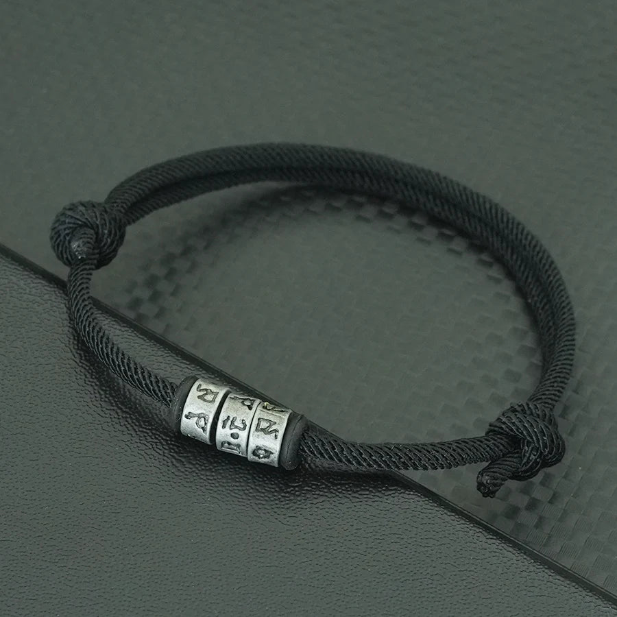Bracelet en Corde Tressée avec Symbole Mystique - Perles Fait Main Ajustable pour Homme