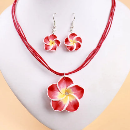 Parure Bohème Fleurs Frangipanier Tressées - Collier et Boucles Plage