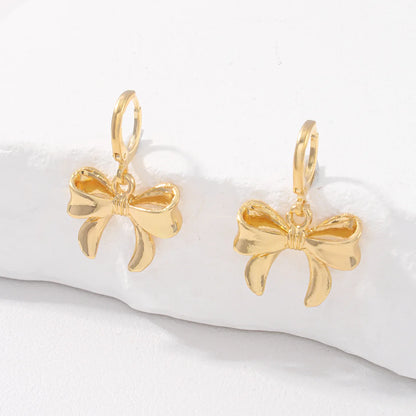 Boucles d'Oreilles Nœud Papillon – Puces Élégantes Tendance Femme