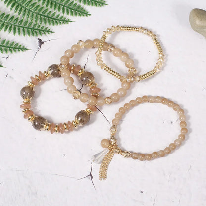 Set de 4 Bracelets Bohèmes Perles Verre Colorées - Pompons et Charms