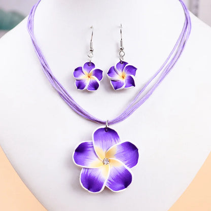 Parure Bohème Fleurs Frangipanier Tressées - Collier et Boucles Plage