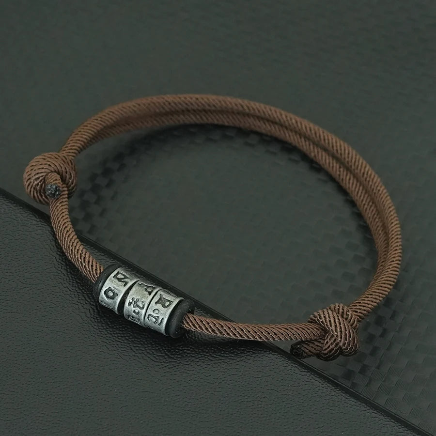 Bracelet en Corde Tressée avec Symbole Mystique - Perles Fait Main Ajustable pour Homme