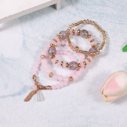 Set de 4 Bracelets Bohèmes Perles Verre Colorées - Pompons et Charms