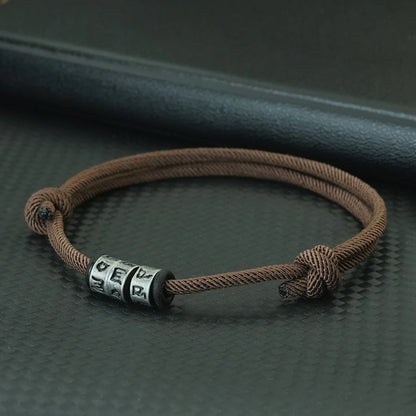 Bracelet en Corde Tressée avec Symbole Mystique - Perles Fait Main Ajustable pour Homme