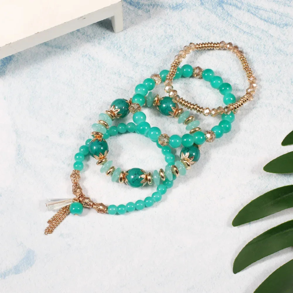 Set de 4 Bracelets Bohèmes Perles Verre Colorées - Pompons et Charms