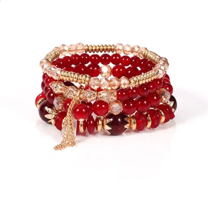 Set de 4 Bracelets Bohèmes Perles Verre Colorées - Pompons et Charms